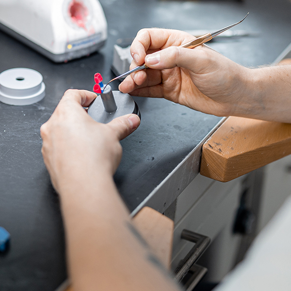 Dental technician producing a wax model