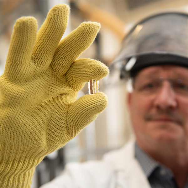 VITA employee performing quality inspection of a VITA AMBRIA Press Ceramic pellet